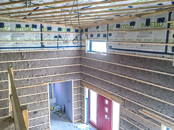 Thermafleece Cosywool sheep's wool insulation between battens on a timber frame wall
