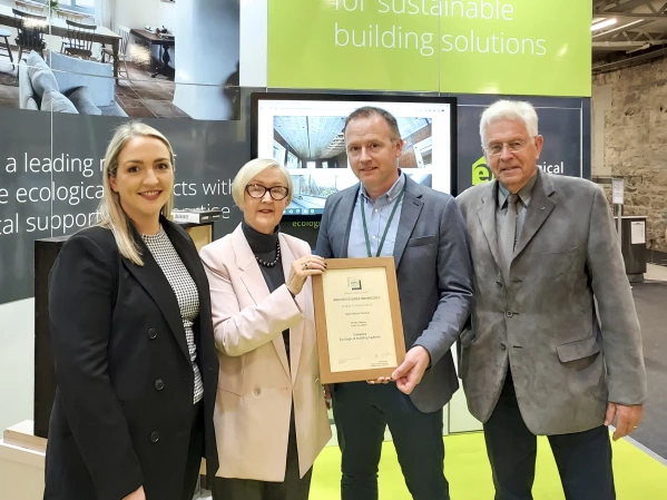 Niall Crosson receiving an award for Retro EcoWall at the Architecture & Building Expo 2022.