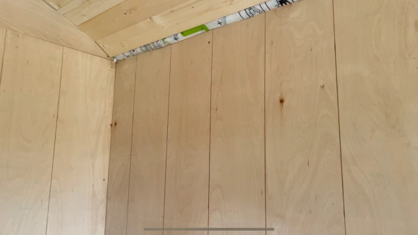 Simulated tongue and groove effect on the internal plywood walls.