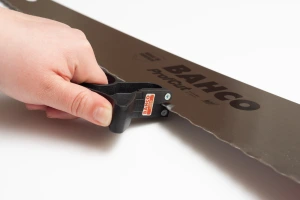 Sharpening the saw with included sharpener