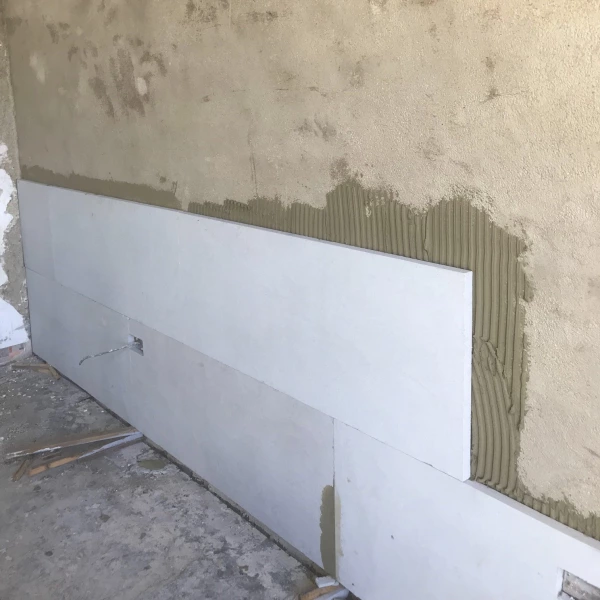 Calsitherm Climate Board installed onto a wall levelled with Diathonite Thermal Plaster