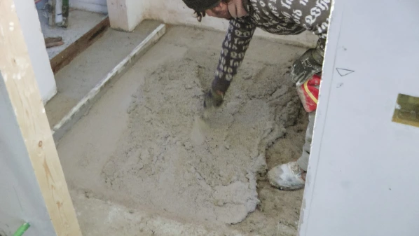 Diathonite Screed being poured and compacted.