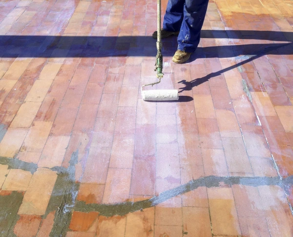 Grip Primer being applied with a roller