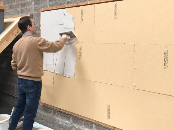 A demonstration of how to apply Lime Green Solo to wood fibre insulation boards