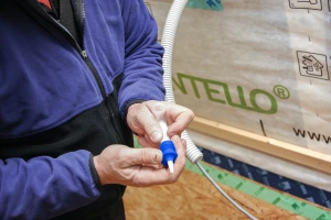 Making hole in the Pro Clima Stoppa