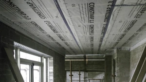 Constivap 2.3 Plus installed over timber ceiling joists and overlaps sealed with Compego airtight tape