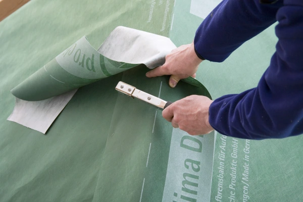 A strip of DA being used to provide extra protection to roof ridge during construction