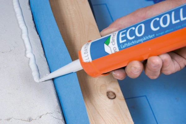 Eco Coll adhesive being used to stick a DB+ membrane to a solid wall