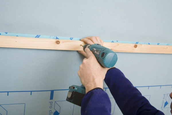 Installing a service batten allows for services and applying this over the tape joint gives extra stability for blown insulation