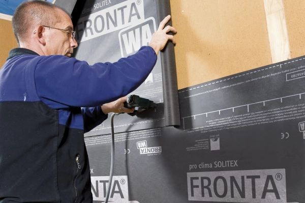 Installing Solitex Fronta WA externally over wood fibre insulation.