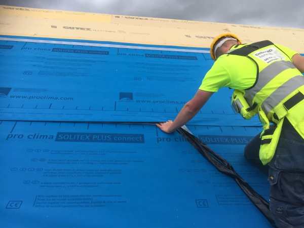 Removing the backing strip for the self adhesive