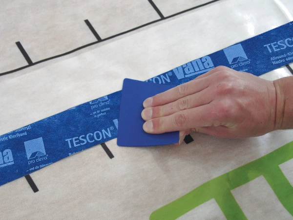 Tescon Vana being smoothed over on an Intello membrane using a Pressfix tool