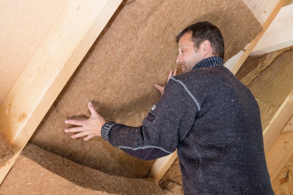 Thermojute matts being fitted in a loft