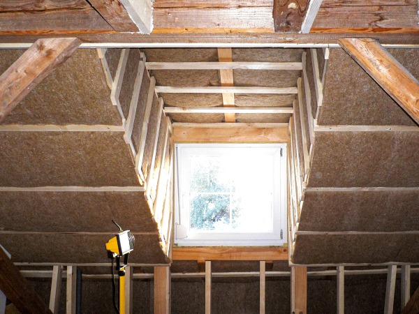 A loft fully fitted with Thermojute insulation showing the detail around the skylight
