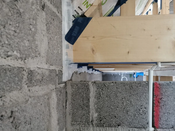 Pro Clima Contega Solido SL airtight tape used to seal the perimeter of the Intello Plus membrane. The tape was then plastered over to complete the airtight layer.