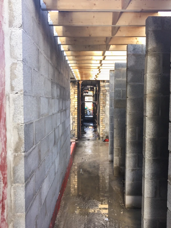 A block wall extension to an existing stone cottage