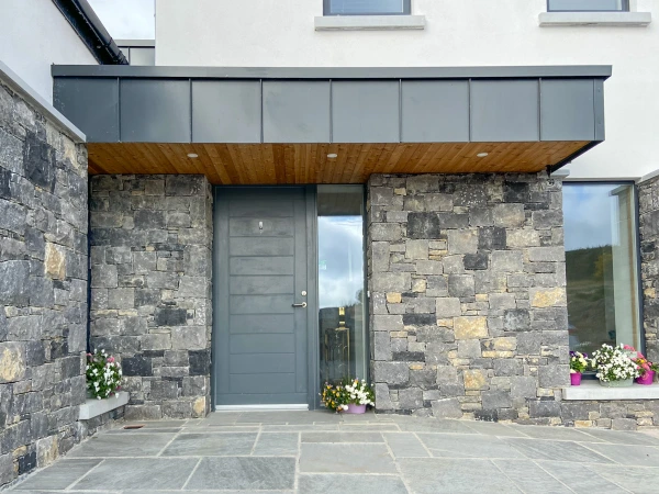 Cavan Passive House in the evening time with view over lake