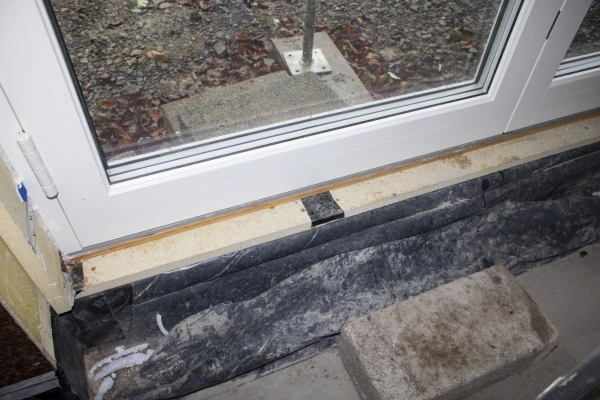 Bosig structural insulation board with Tescon Profil airtight tape on a threshold