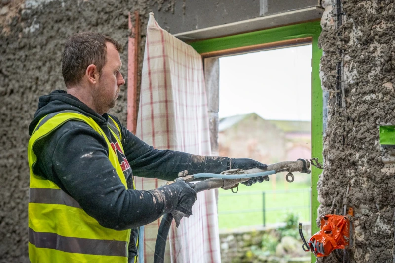 Diathonite Thermactive being spray applied around a window reveal