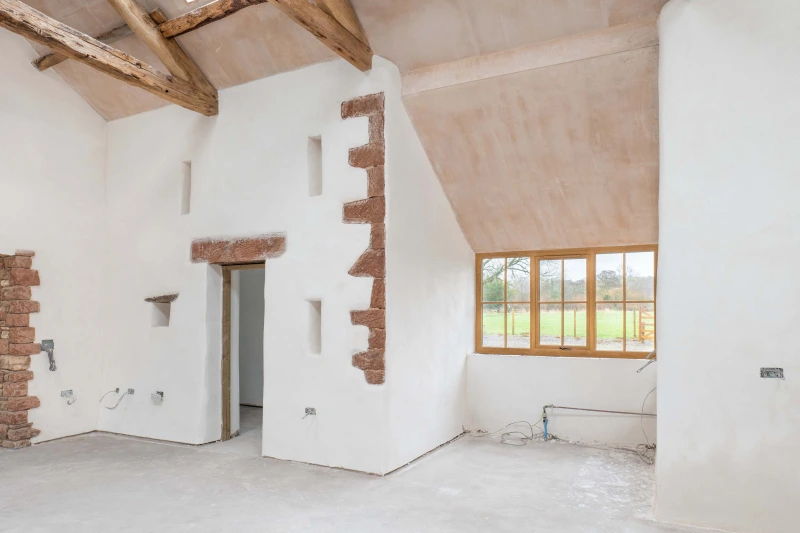 Cured Diasen Argatherm finishing plaster around a window and door