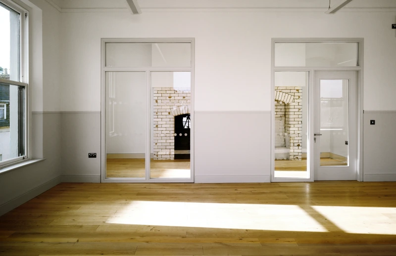Finished internal wall with glass panels and door