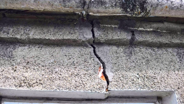 Cracking appearing in the brickwork above the windows