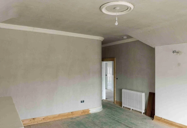 Bedroom wall drying after thermal plaster has been applied