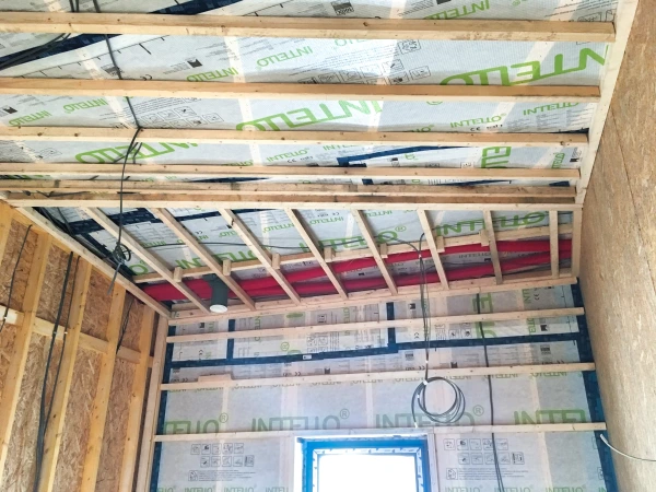 Intello Plus airtight membrane on a timber frame sealed with Tescon Vana airtight tape